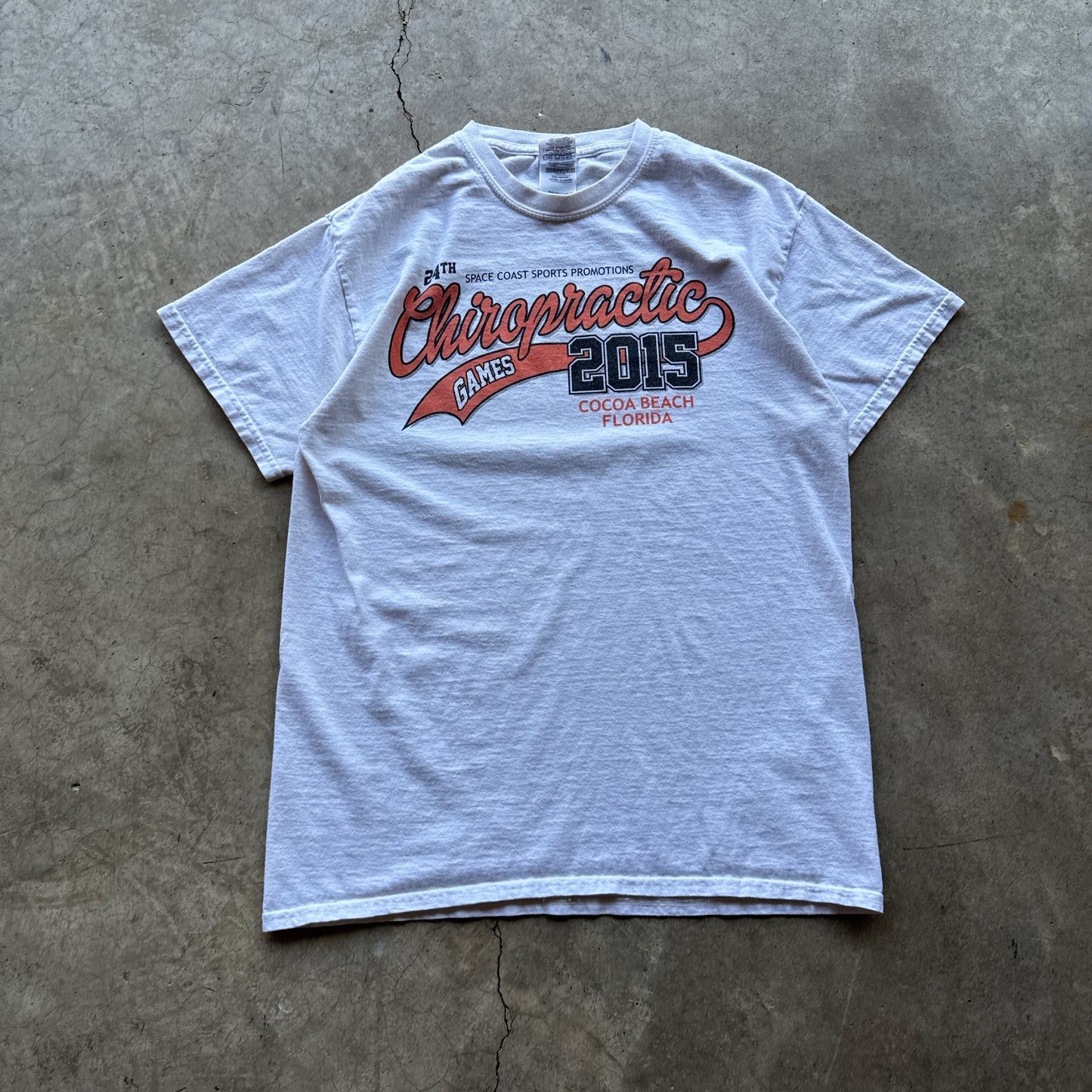 White ‘Chiropractic Games’ Tee - M